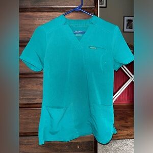 Green colored Jaanuu scrub top in size XS